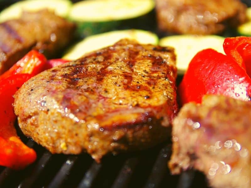 steak and veggies on a grill