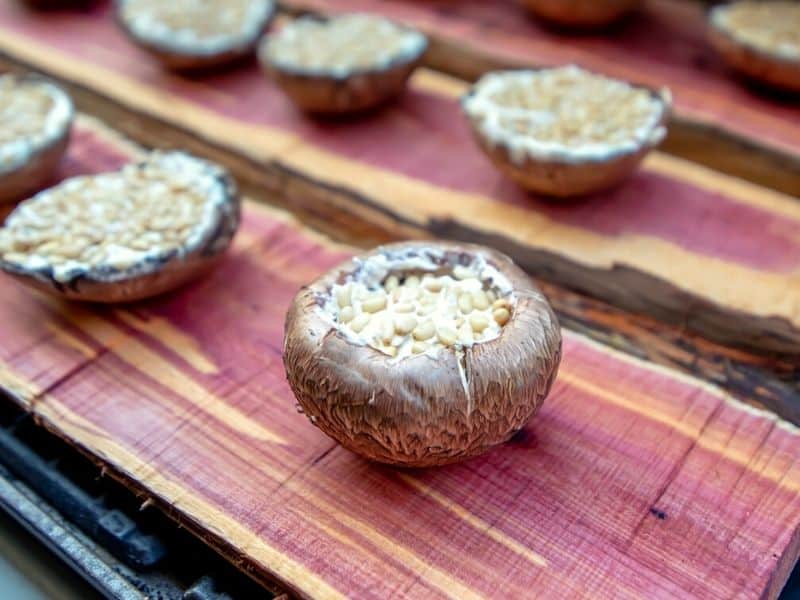 Grilling portobello mushrooms on cedar plank