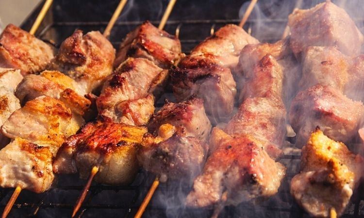 chicken sticks on a grill