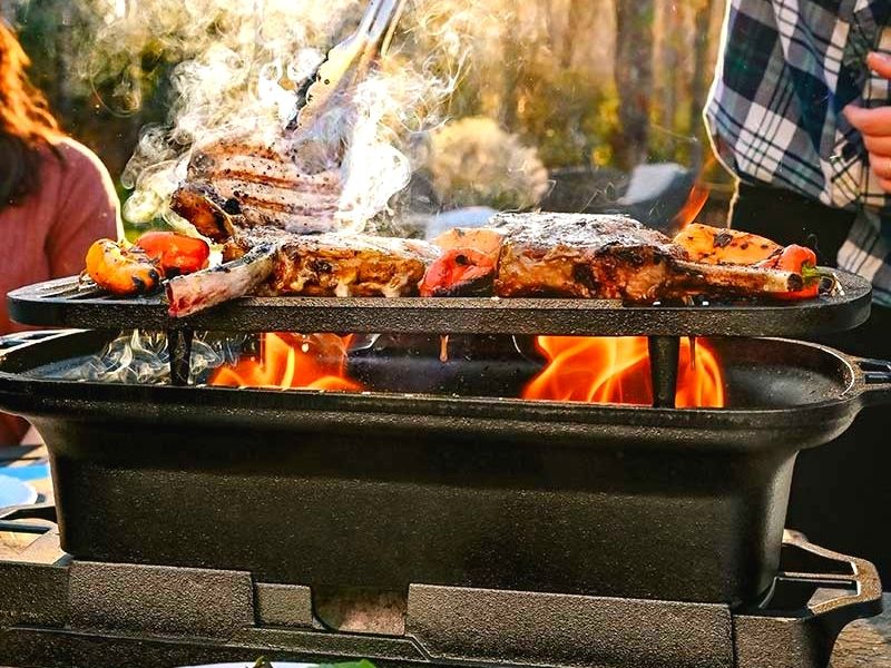 Lodge Sportsman Pro Grill with Pork Chops and Veggies