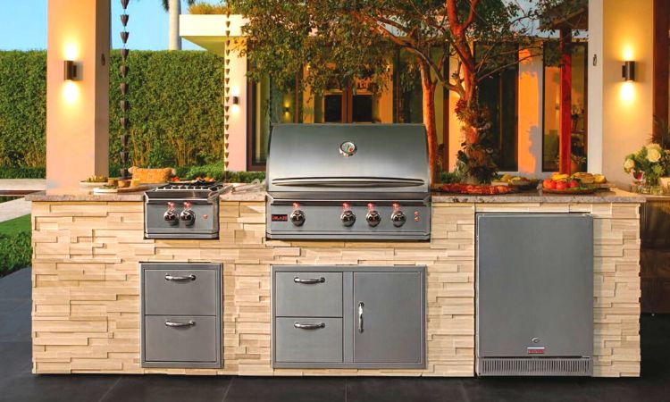 An outdoor kitchen with Blaze grill and cabinets