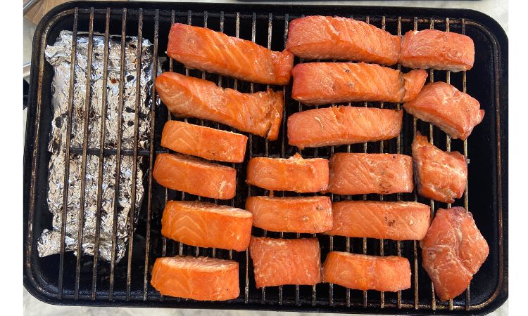 smoked candied salmon on a charcoal grill
